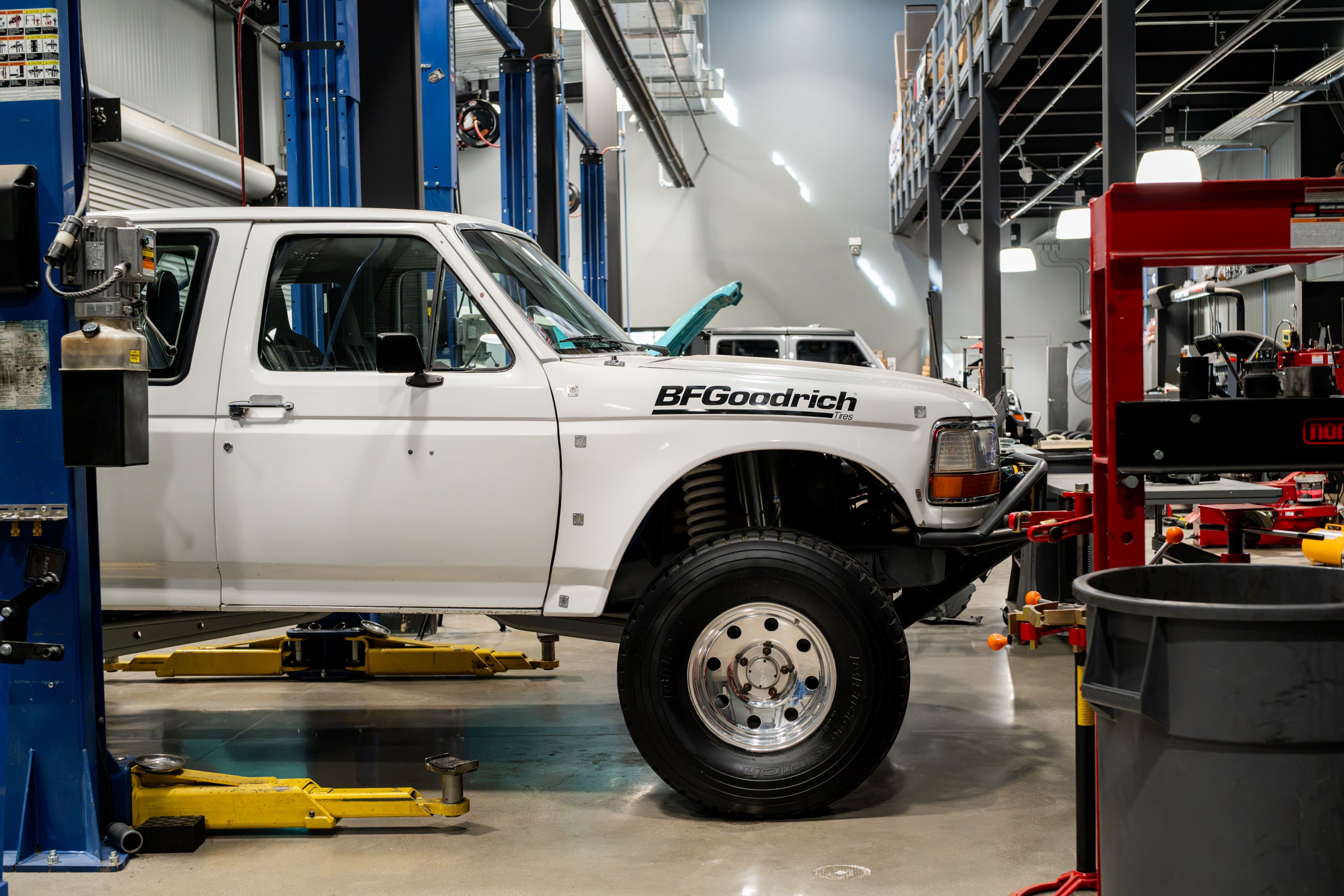 A custom off-road vehicle on one of the service bays at Bronco Bran